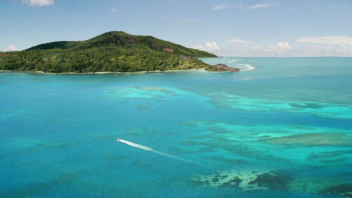 Aerial view of an island in the Seychelles surrounded by ocean