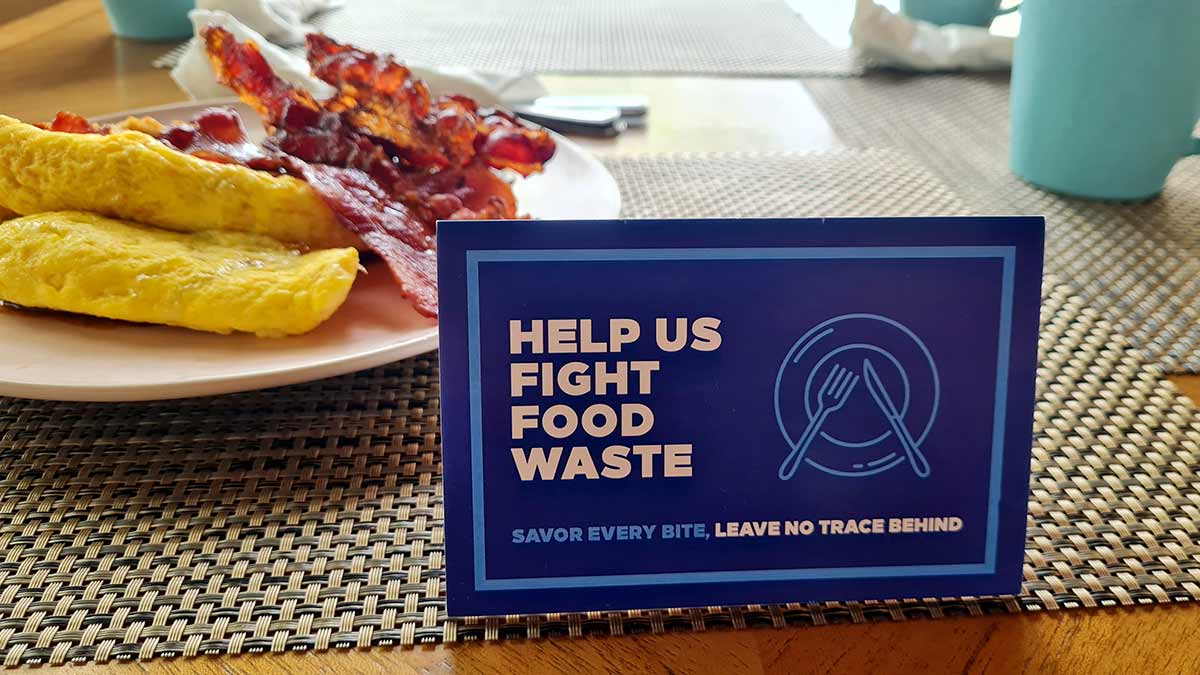 Signs telling travelers to reduce their own food waste are a form of greenwashing because they put the burden of sustainability upon the guest.