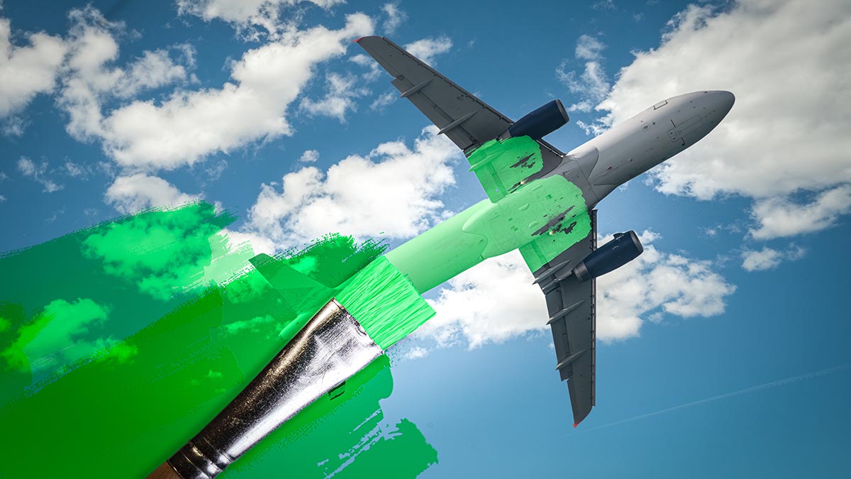 A plane flies as it is painted with a green paintbrush to symbolize greenwashing