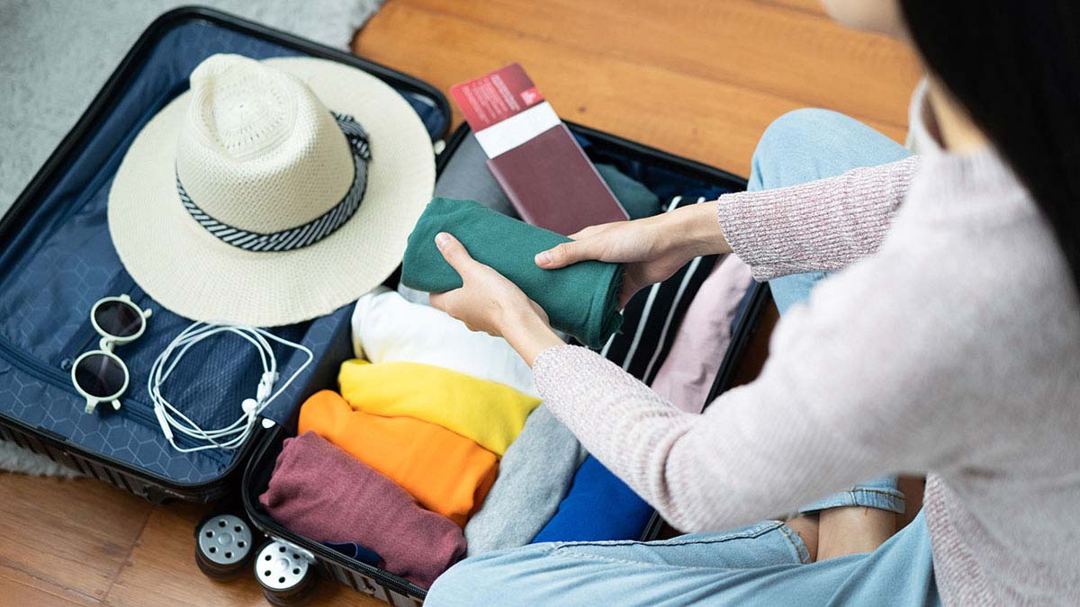 Woman packing her suitcase