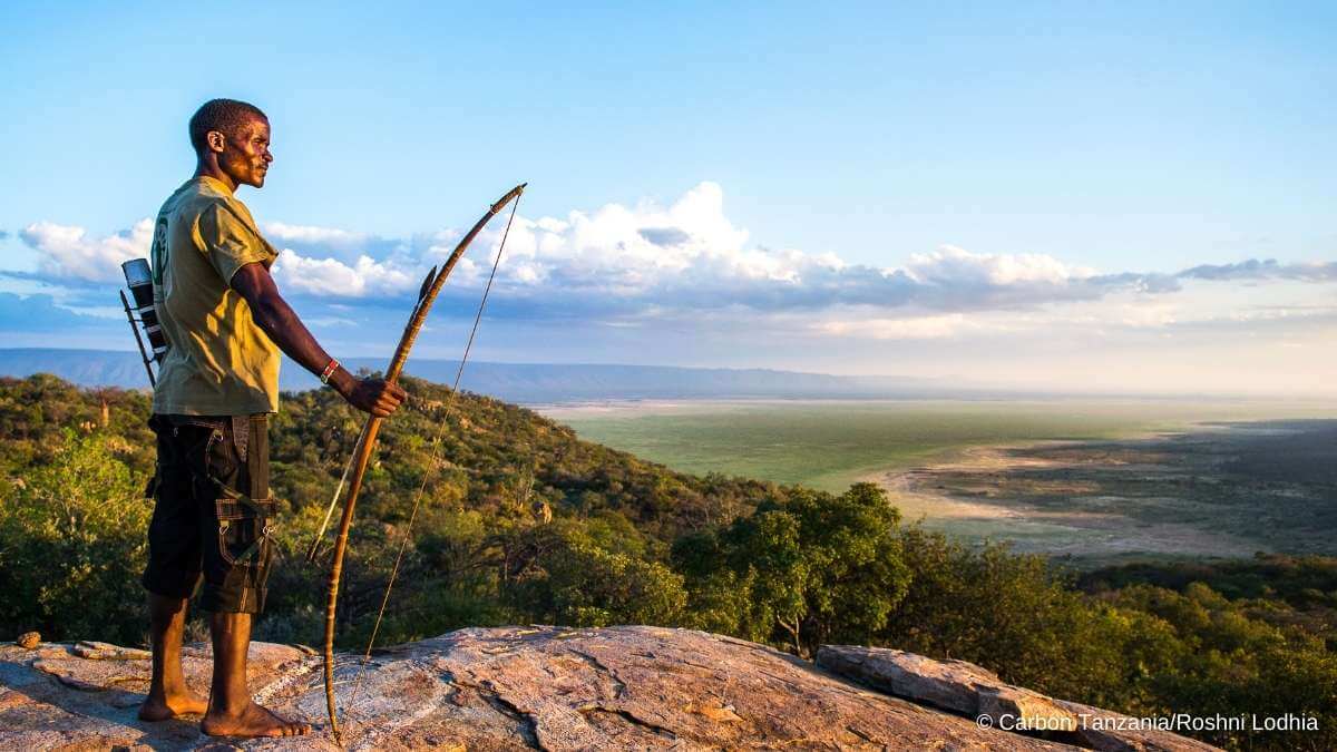 An indigenous man watches over the forests being protected by the Yaeda-Eyasi Landscape carbon offset project