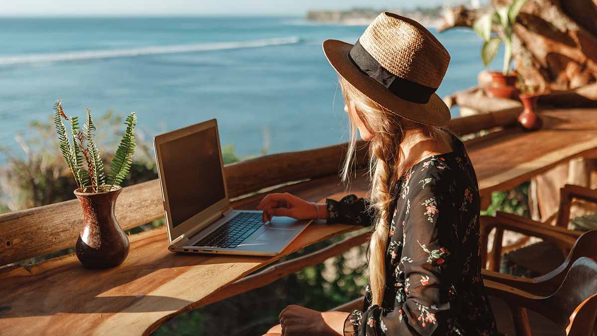 A digital nomad works from a remote destination