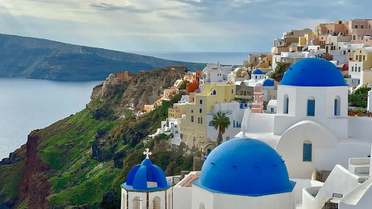 Whitewashed buildings in Santorini Greece along the coast