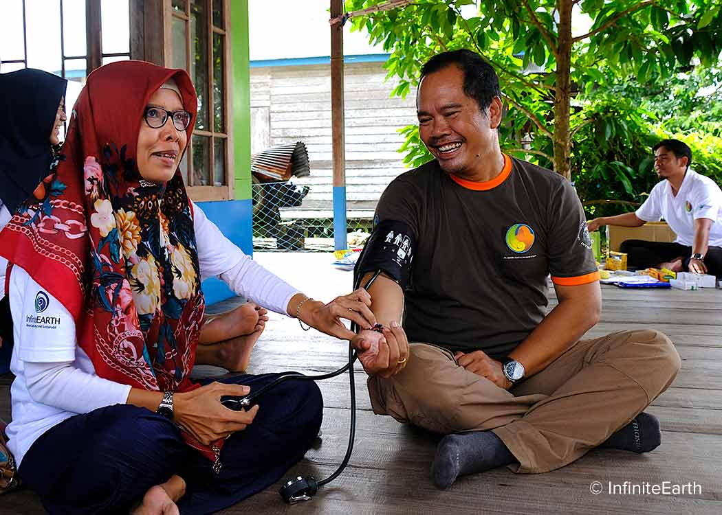 Health check at local village, a community initiative of Rimba Raya Biodiversity Reserve carbon offset project