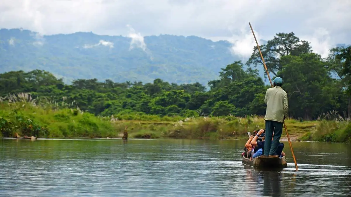 A local ecotourism guide navigates Chitwan National Park in Nepal