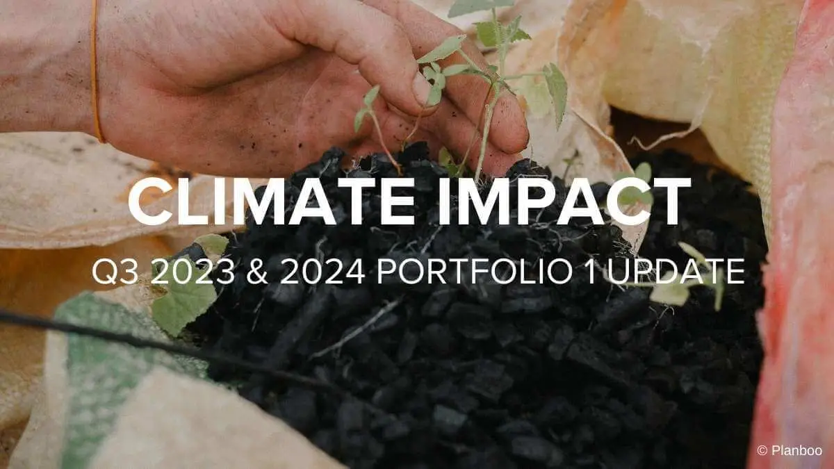 A hand holds a seedling planted in biochar from the Elpitiya Biochar Project. This project is part of Sustainable Travel International's Q4 2023 climate impact portfolio and 2024 portfolio 1.