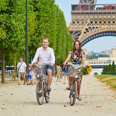 A couple biking in Paris