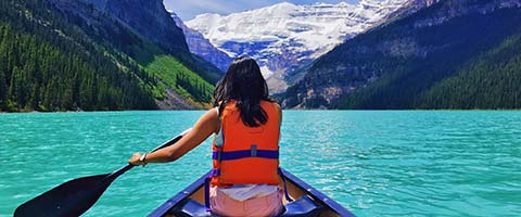 Girl kayaking on a lake