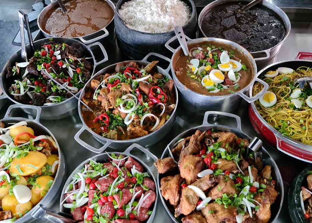 Brazilian Minas Gerais cuisine made on a wood stove with rice, beans, feijoada.
