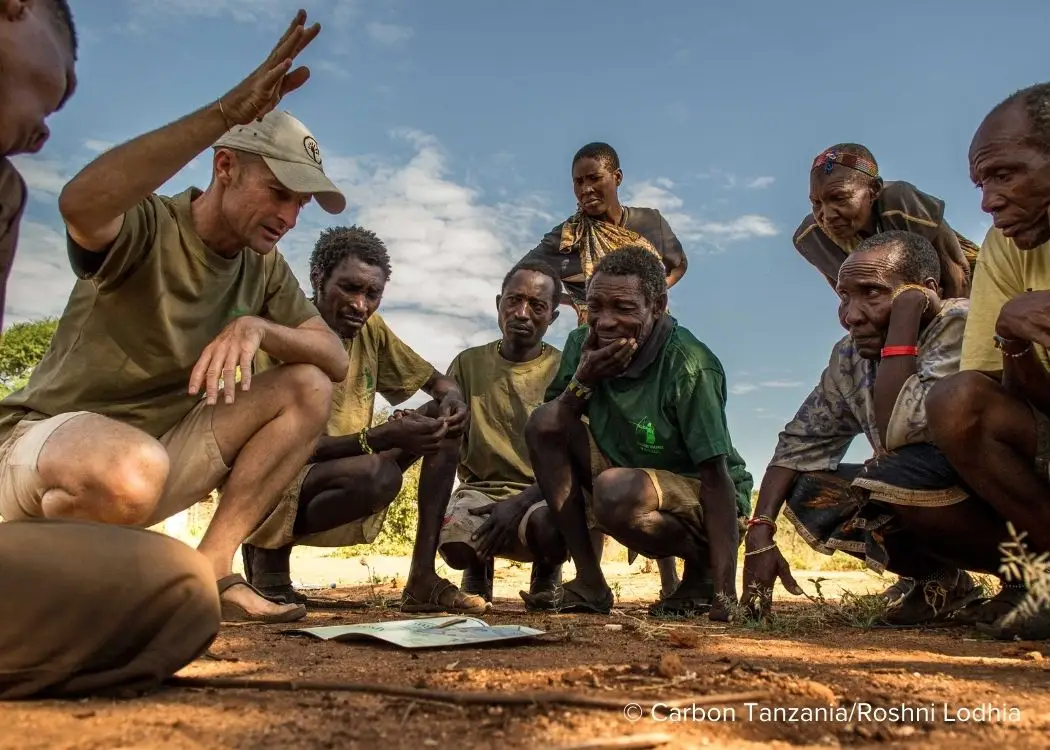 Men discussing in the field