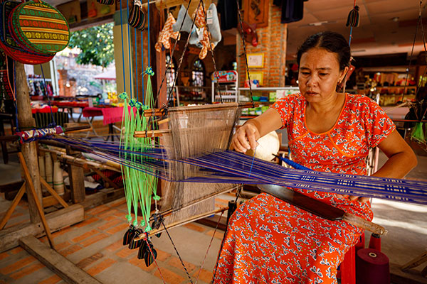 A local community member weaving