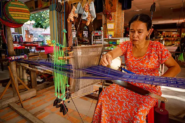 A local community member weaving
