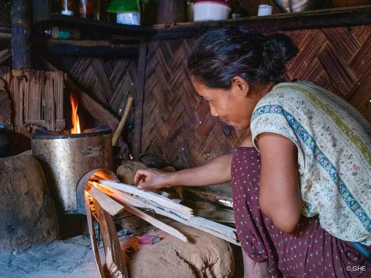 Woman cooking with the new cookstove in Garo Hills